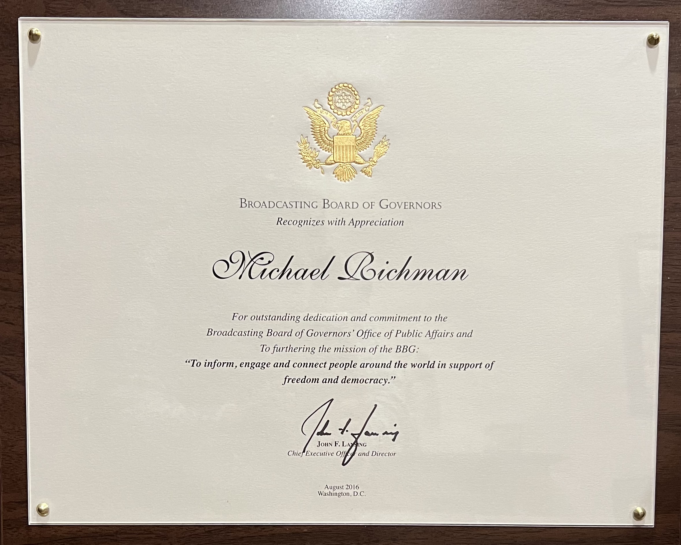The Broadcasting Board of Governors, the U.S. government body that oversees the Voice of America and other U.S.-funded broadcast agencies, presented Mike Richman with a plaque in 2016 for his "outstanding dedication and commitment" to the BBG's Office of Public Affairs.