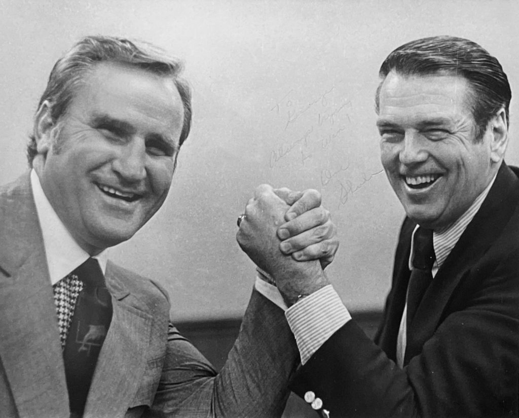 Coaching rivals Don Shula and George Allen pose for an arm wrestling photo in 1973, a few months after Shula's Dolphins beat Allen's Redskins in Super Bowl VII.